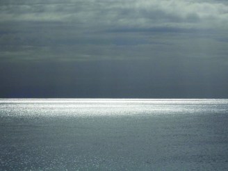 Gloria Treadway's entry of a sunset, titled "Fifty Shades of Grey," was shot on color film. The lack of color in the sunset is what caught Treadway's eye and inspired the picture.