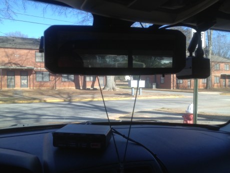 The new Digital-Ally video recorders are integrated into the patrol cars' rearview mirrors. Although some officer-citizen contact occurs outside the video frame, all officers assigned to the Uniform Patrol Division wear recorders on their uniforms that enable audio recordings to be captured remotely away from their vehicles.