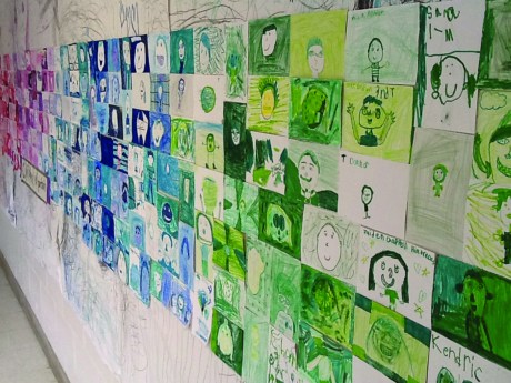 Students learned about drawing and color theory earlier in the year when they each completed a monochromatic self-portrait. When each class finished, art instructor Laurel Denham placed all portraits in one color family together to create a color wheel.