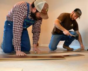 The men of Impact Racing Ministry and Strong Rock Outdoors were instrumental in assisting the family of Marcus, Sonya and Marasia Dallas as they sought to renovate their family home. Photo courtesy of Michael Renew